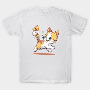 Kitten plays with a butterfly. T-Shirt